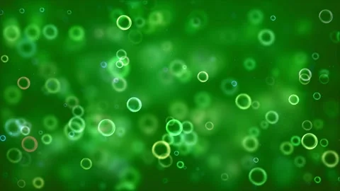 Rings floating in green bokeh background cinematic dynamic footage clip Stock Footage 327570221
