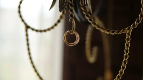 Rings hang on the sconce Stock Footage 83395066