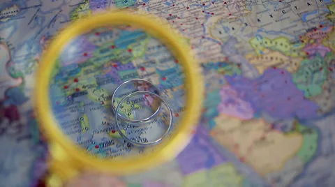 Rings lie on the map, lens Stock Footage 64181674
