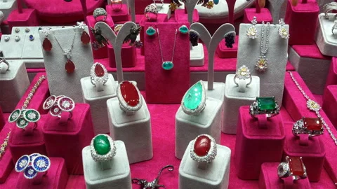 Rings, necklaces and earrings with red and green stones in 4K Video stock 134570877