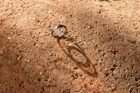 Rings on Rustic Ground in Sunlight Stock Photos