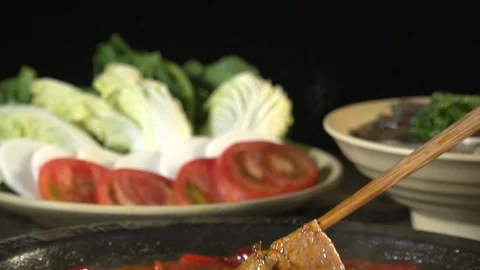 Rinse beef hot pot in slow motion Stock Footage 111742068