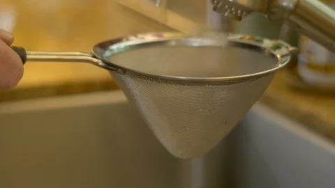 Rinsing capers C/U Stock Footage 117541644