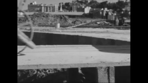 RIO DE JANEIRO - 1961 - Construction workers wheeling carts and walking barefoot Stock Footage 340587164