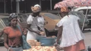 Rio De Janeiro - 1977: Woman Sellers In Street Together By Stall Chat Together Stock Footage