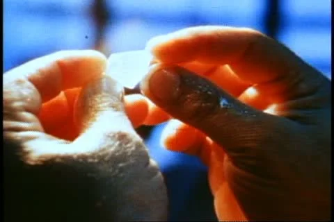 Rio de Janeiro 1982, gemstones, close up hands, examine raw gem Stock Footage