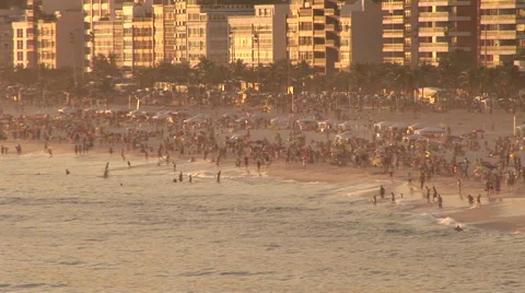 Rio de Janeiro: Beach Goers and City at Sundown Stock Footage 47014206