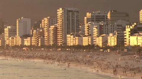 Rio de Janeiro: Beach Goers and City at Sundown (2) Stock Footage 47014840