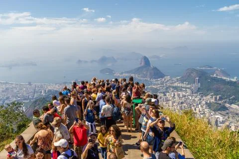 Rio de Janeiro, Brazil - August 23, 2018: Dozens of tourists take pictures of Stock Photos