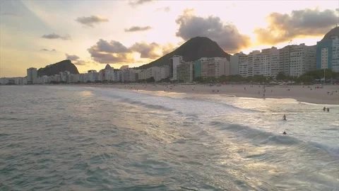 RIO DE JANEIRO, BRAZIL- CIRCA 2022: Fly above famous Copacabana beach and Stock Footage 240575334