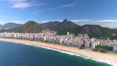 RIO DE JANEIRO, BRAZIL- MAY 2023: Fly above famous Copacabana beach and Atlantic Stock Footage 240579445