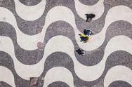 Rio De Janeiro, Brazil, Top View Of People Walking On Copacabana Beach Sidewalk Stock Photos