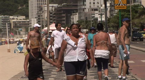 Rio de Janeiro: Compression Shot of People Walking On Boardwalk (1) Stock Footage 46970097