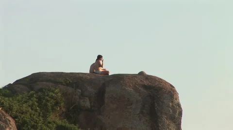Rio de Janeiro: Couple Seating on a Large Rock Stock Footage 47012189