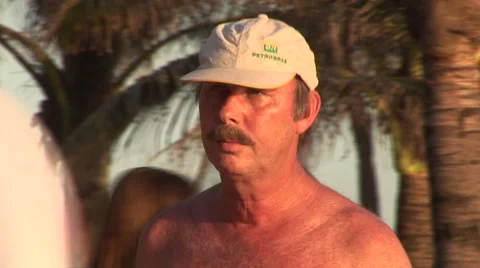 Rio de Janeiro: CU of Man Walking Shirtless Stock Footage 47011091