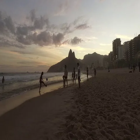 Rio de Janeiro - Flying over people playing football on Ipanama Beach 動画素材 69707176