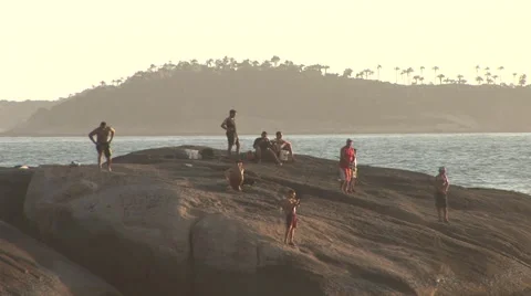 Rio de Janeiro: People Standing Atop a Rock by the Ocean Stock Footage 47013458