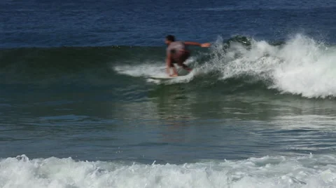 Rio de Janeiro: Surfer Catches Wave on Ipanema Beach Stock Footage 45331695