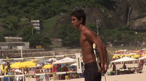 Rio de Janeiro: Surfer Standing on Beach Stock Footage 46971720