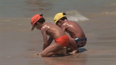 Rio de Janeiro: Two Kids Play on the Beach Stock Footage 46977869