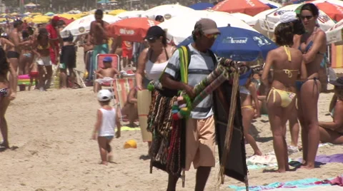 Rio de Janeiro: Vendor Walking On Crowded Beach Stock Footage 46992202