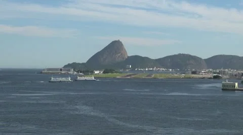 Rio Sugar Load and docks across the bay with ferries Stock Footage 11059099