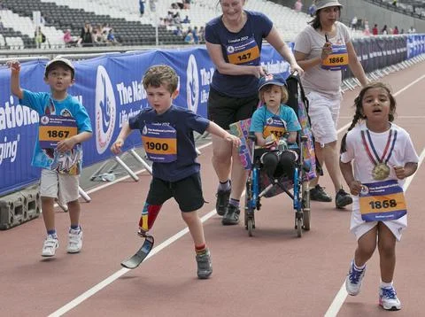 Rio Woolf 5 Taking Part In The National Lottery Family Run At The Olympic Park. Fotos de archivo