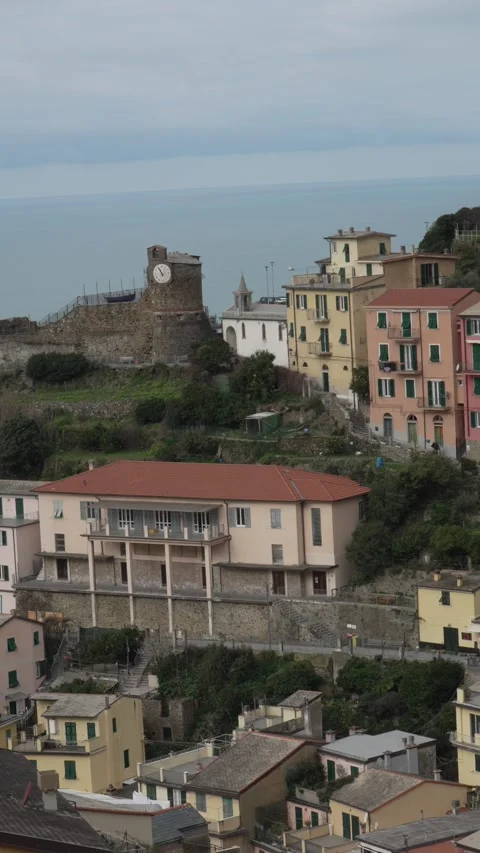 Riomaggiore Clock Tower - Townscape Overlooking Sea. Video stock 329848071