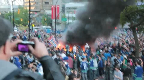 Riot - car burns, crowd control, chaos, large crowd, police Stock Footage 11226388