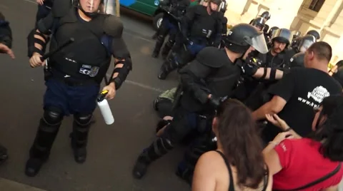 Riot Police Arrests Man on Demonstration Stock Footage