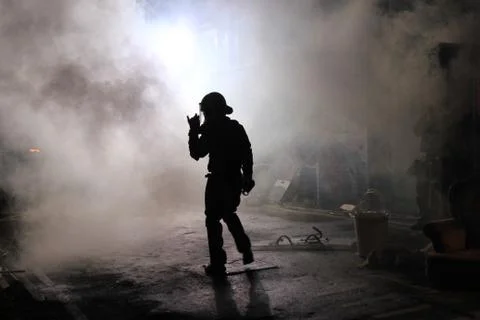 Riot policeman in smoke Stock Photos