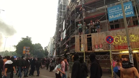 Rioters pulling apart wall facade in spectacular chaotic scene at G20 riots - Stock Footage 91925244