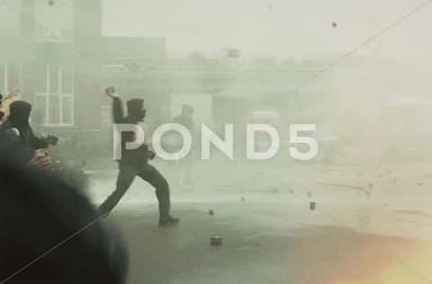 Rioters throwing stones Stock Photos