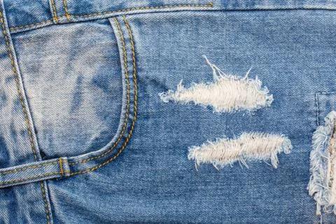 Rip blue jeans Stock Photos