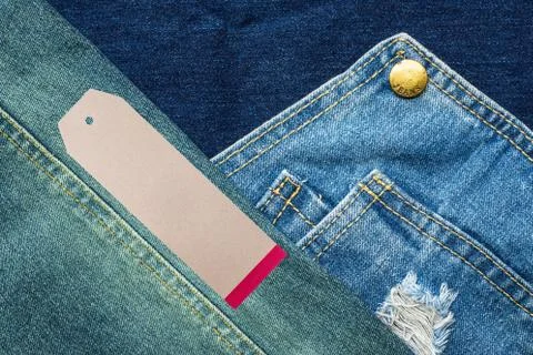 Rip jeans texture background with tag Stock Photos