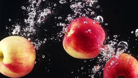 Ripe Apples Falling Through Water. Stock Footage 73040064