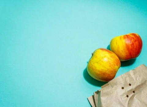 Ripe apples with paper bag isolated. Supermarket online shopping. Shopping de Stock Photos