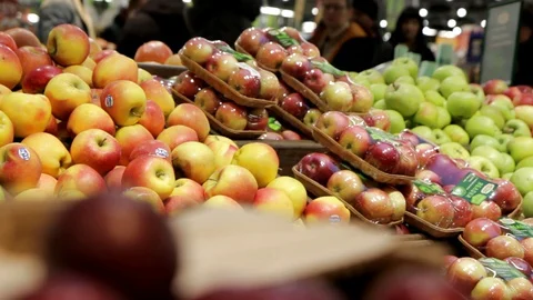 Ripe apples in the store. Large selection of fresh fruits at the grocery market. Stock Footage 128240205