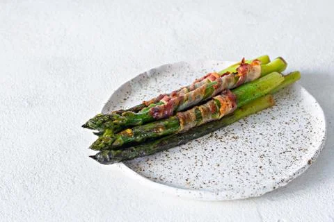 Ripe baked asparagus with bacon Stock Photos