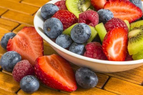 Ripe berry and kiwi in a small bowl Stock-Fotos