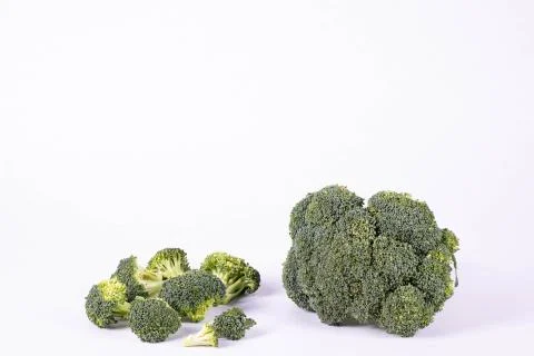 Ripe broccoli lies on a table Stock Photos