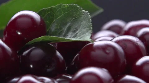 Ripe cherries on a black background. Rotation 360. Video stock 56687785