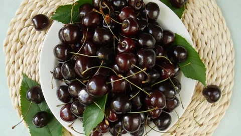 Ripe cherries on a plate. Stock Footage 302920562