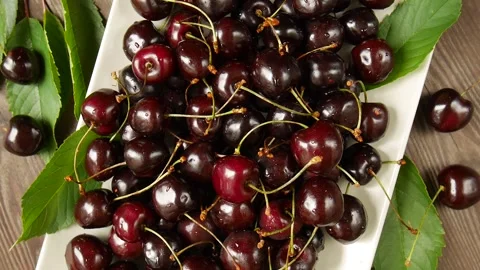 Ripe cherries on a plate. 스톡 동영상 303199812