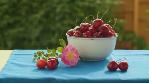 Ripe cherry in the bowl on the table Stock Footage 135864469
