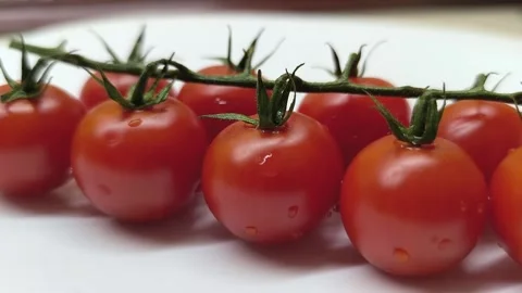 Ripe cherry tomatoes on a plate. Stock Footage 289677862