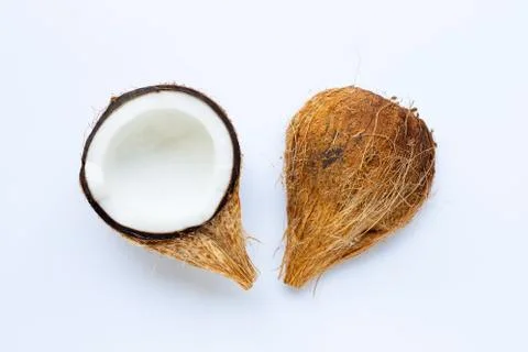 Ripe coconuts on white. Top view of tropical fruit. Stock Photos