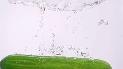 Ripe Cucumber Falling Through Water. Stock Footage 73551372