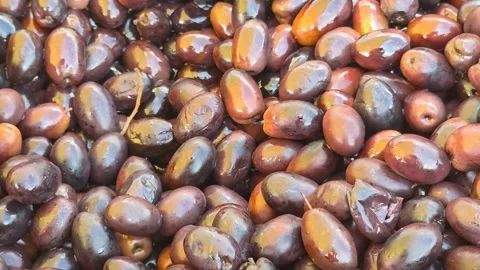 Ripe dark olives surface close up panning camera movement culinary backgroun Stock Footage 343797190