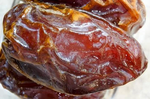 Ripe dry dates close-up. Macro shooting photo. Stock Photos